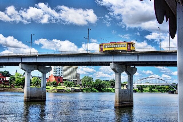 River Rail Electric Streetcar running across Arkansas river