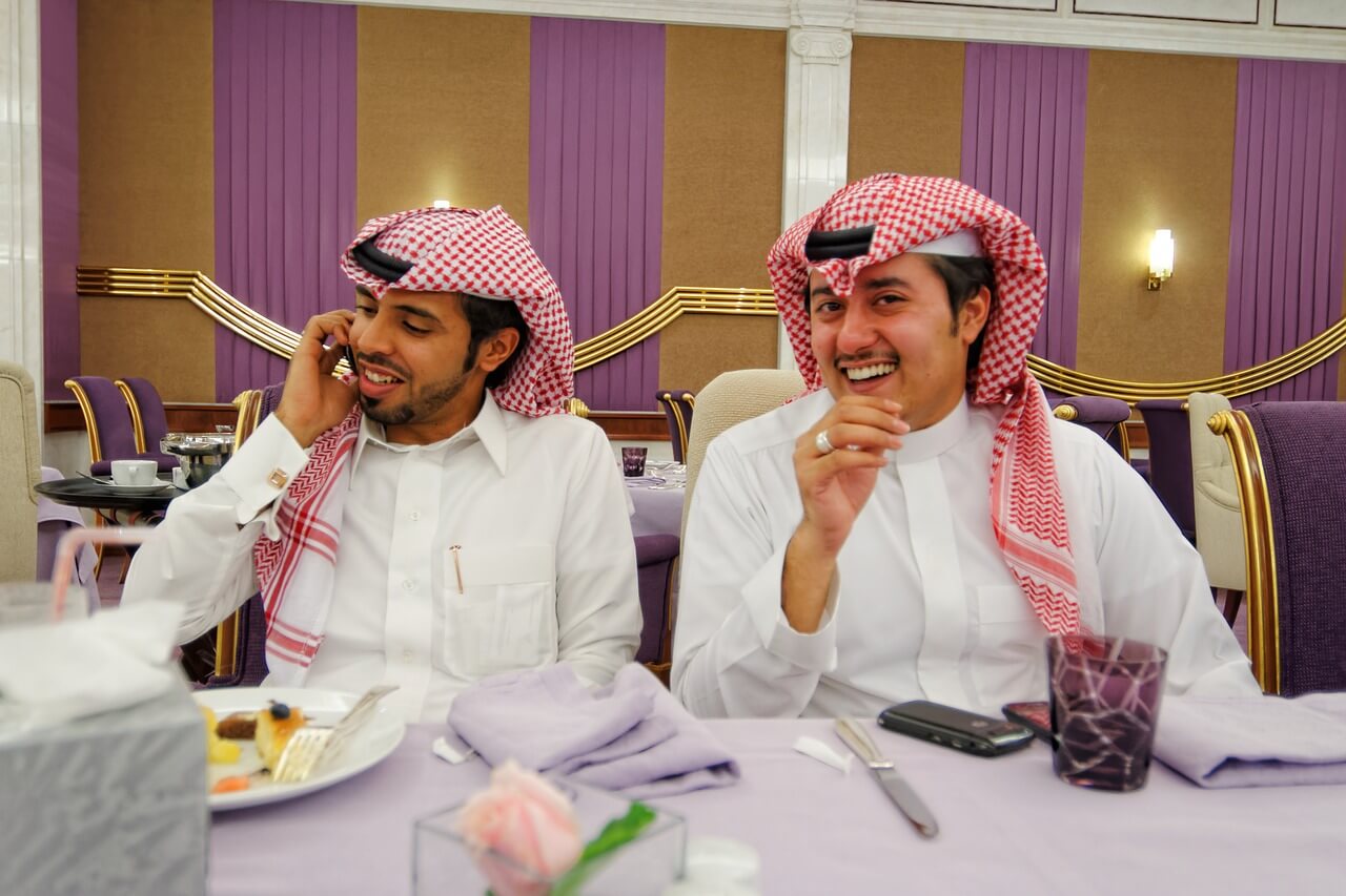 Two Arab men enjoying lunch