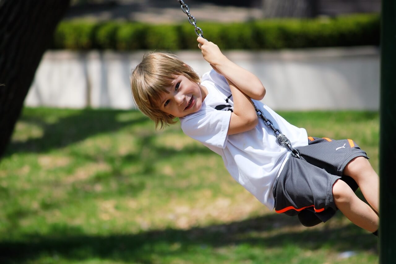 kid playing on a playground