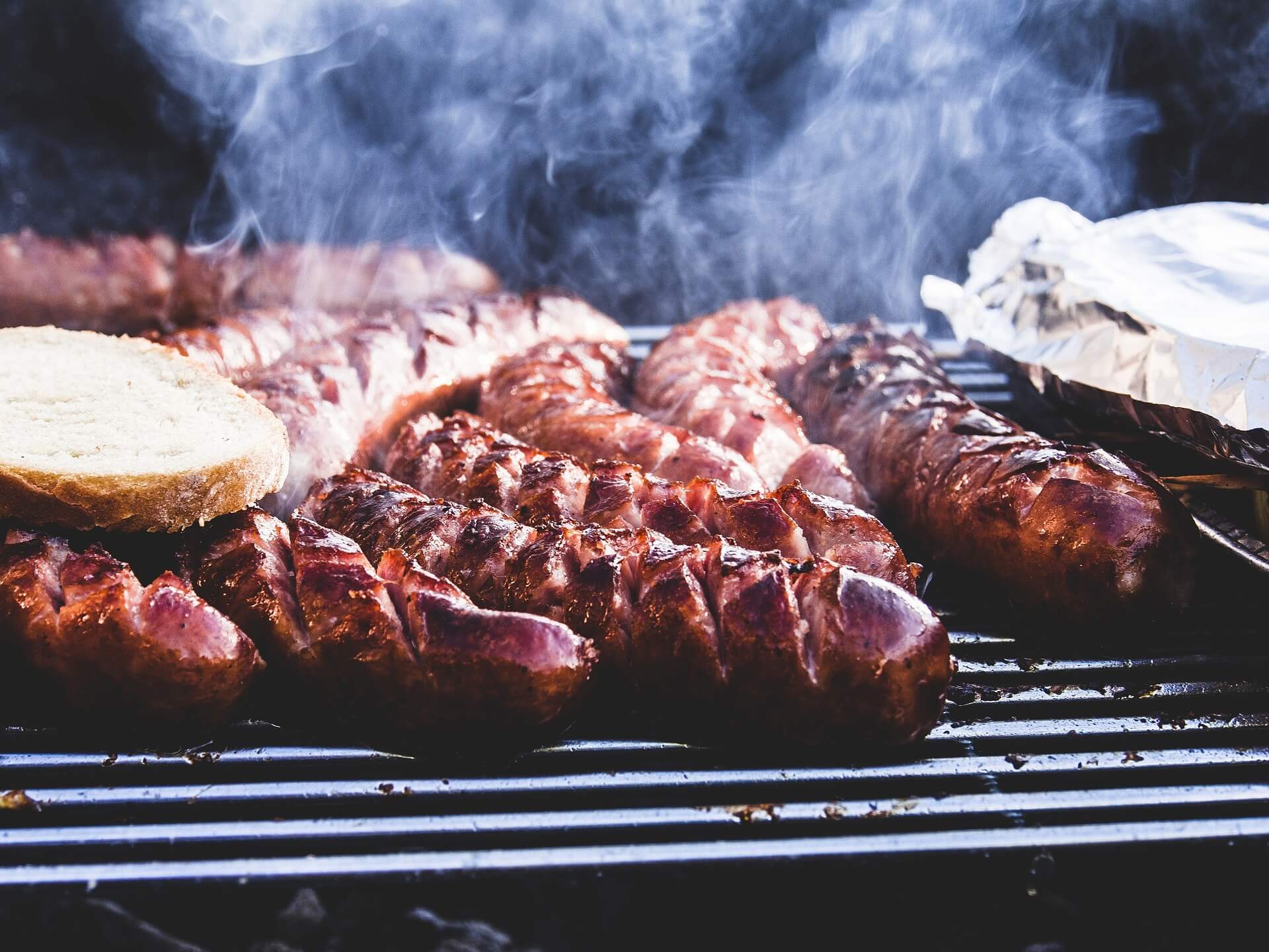 Grilling sausages perfectly on a barbecue is one of the 6 things to learn after moving to Alabama