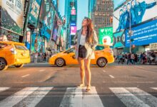 Enjoy Life In New York City - Woman standing on a crosswalk in NYC