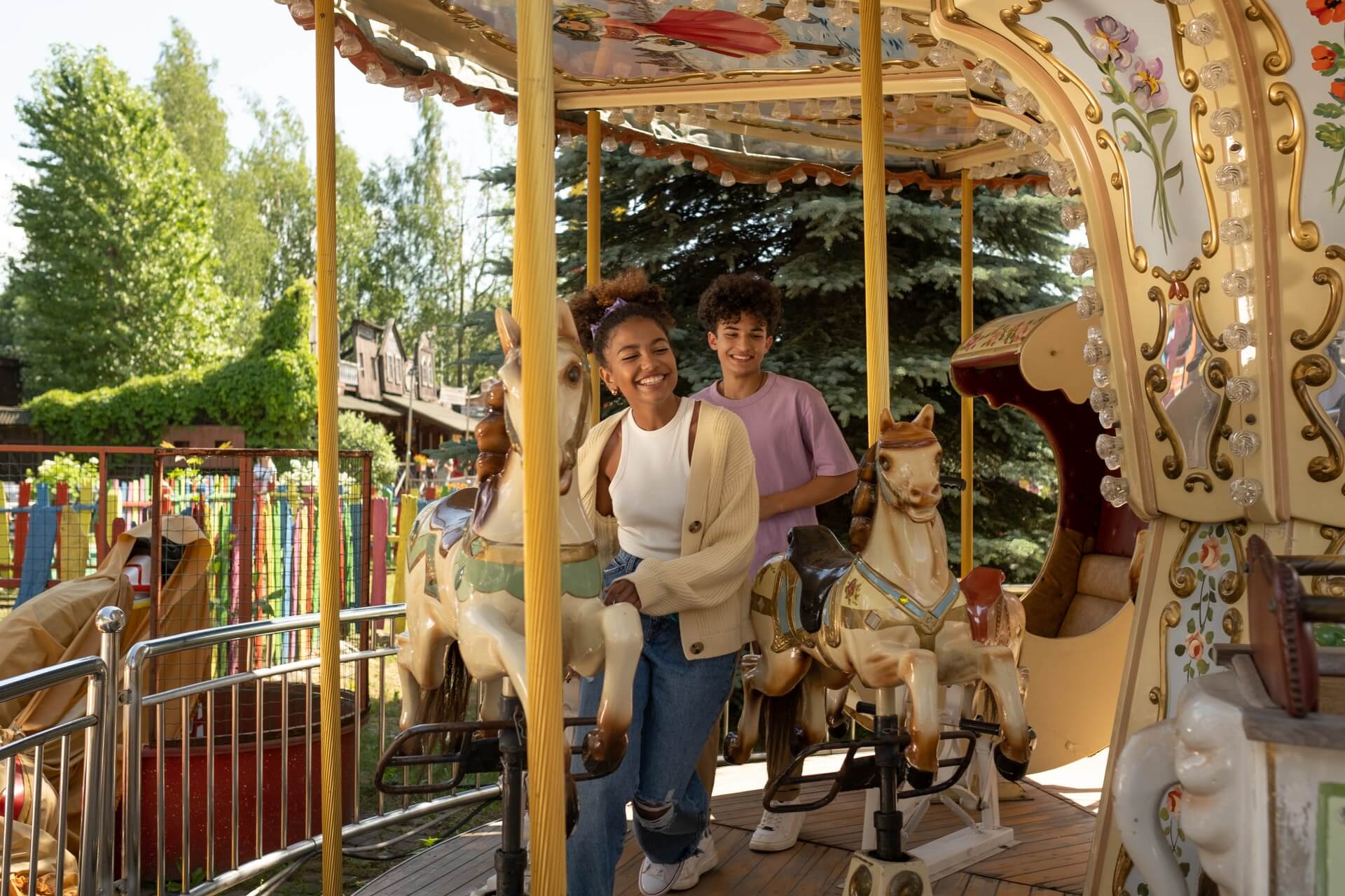A boy and a girl on a carousel at Prospect Park in Brooklyn