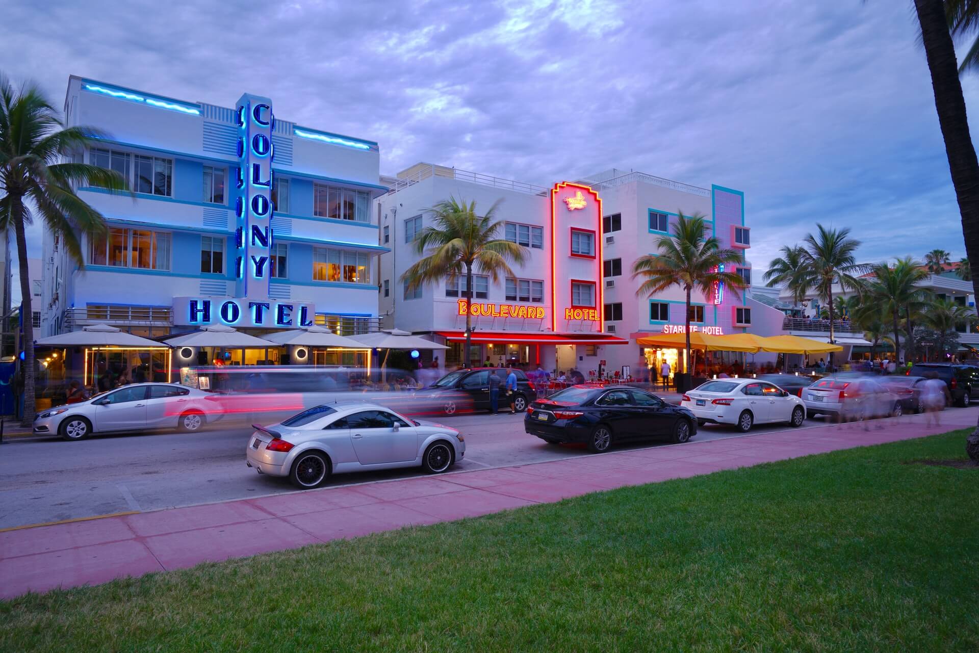 A street filled with buildings in the Art Deco style at dusk