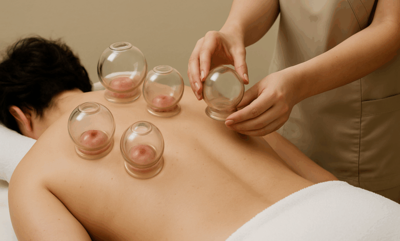 Professional cupping therapy being performed with glass cups on the back
